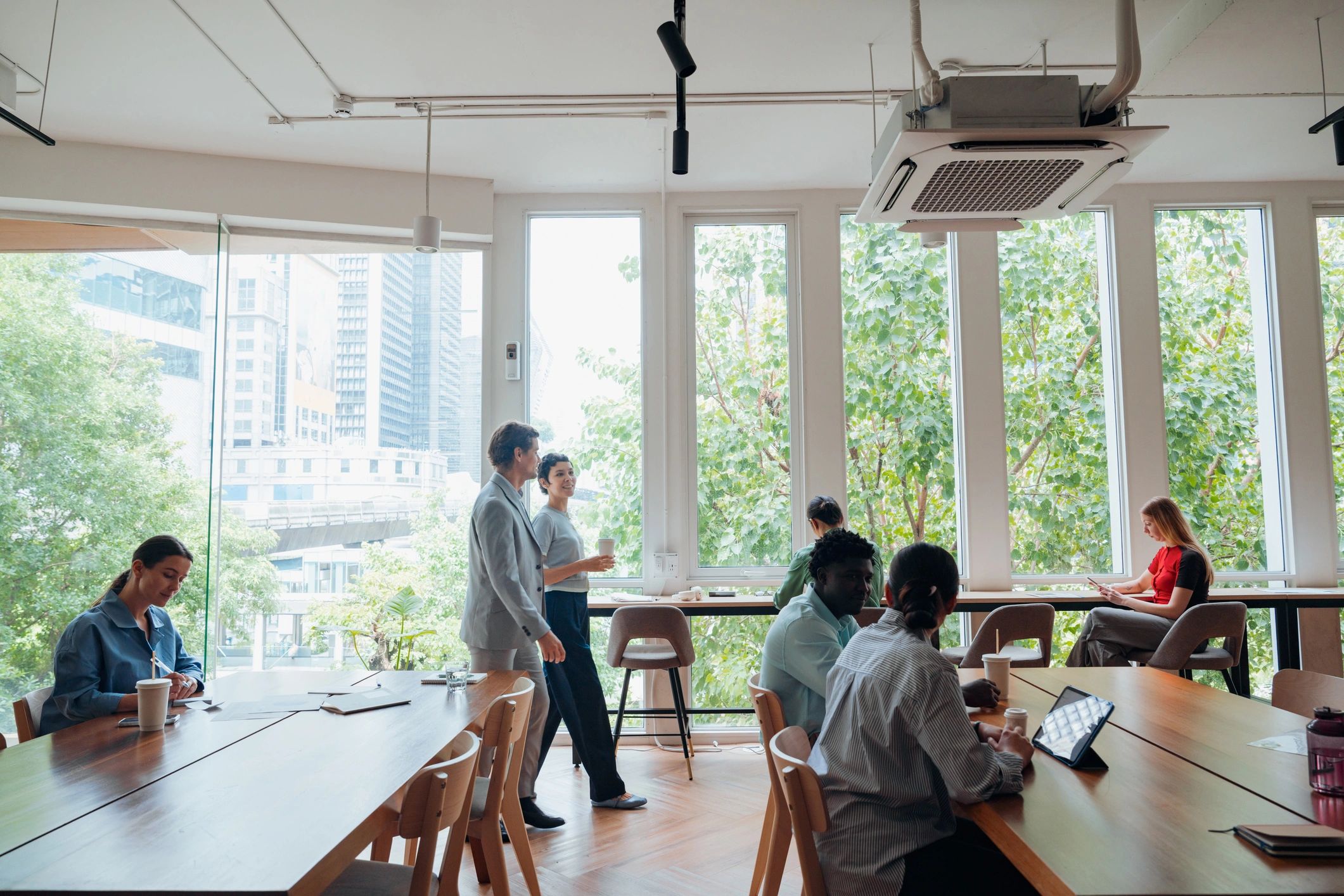 Creative team discussing software solutions in a collaborative workspace